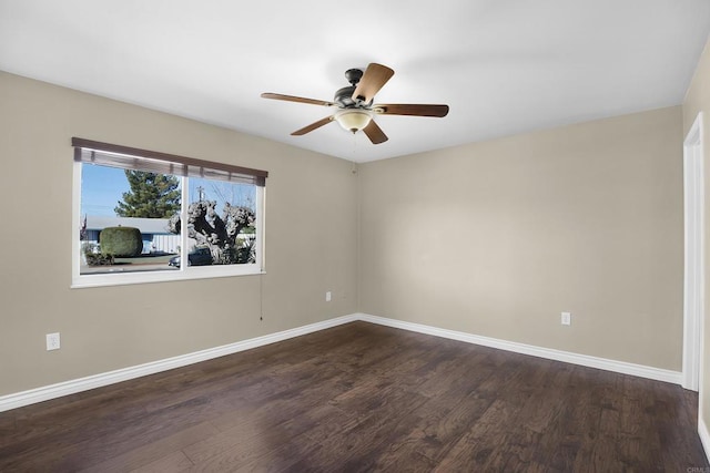 unfurnished room featuring ceiling fan and dark wood-type flooring