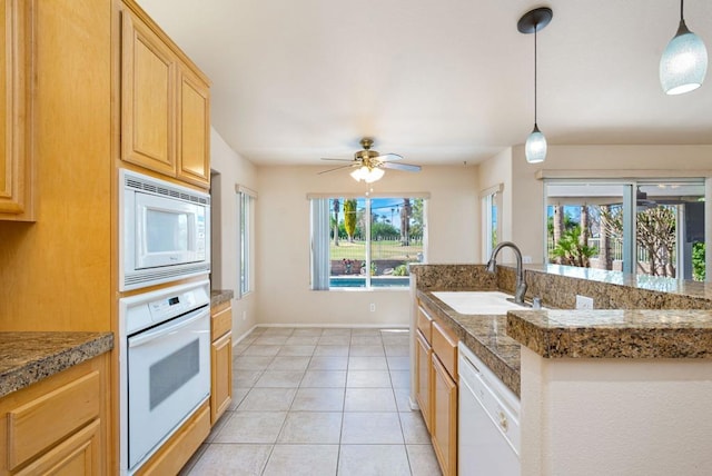 kitchen featuring pendant lighting, white appliances, sink, ceiling fan, and light tile patterned floors