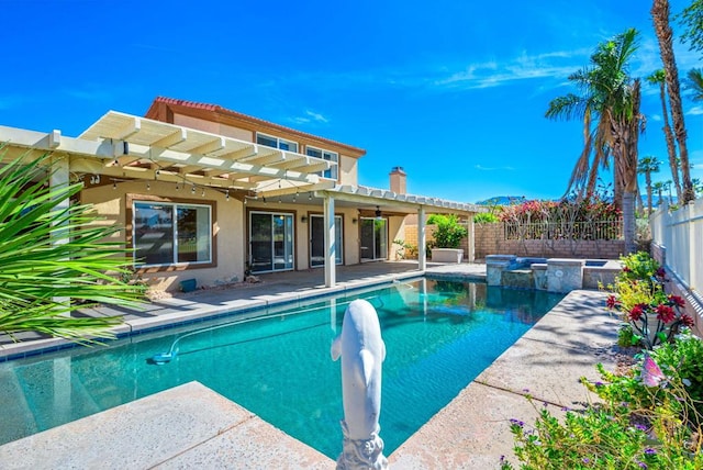 view of pool featuring ceiling fan, a pergola, a patio area, and an in ground hot tub