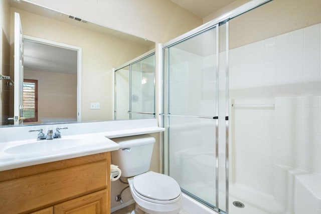 bathroom with a shower with door, toilet, and vanity