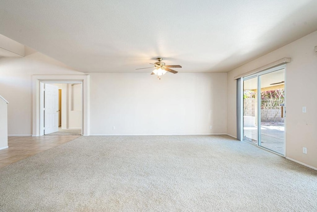 carpeted empty room featuring ceiling fan