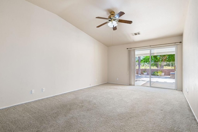 carpeted empty room featuring ceiling fan and vaulted ceiling