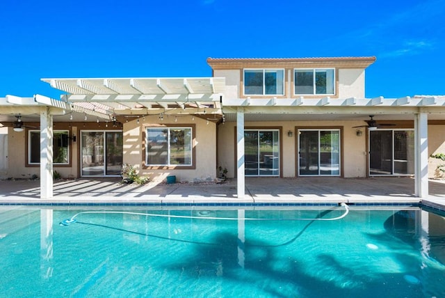 view of swimming pool with a pergola and ceiling fan