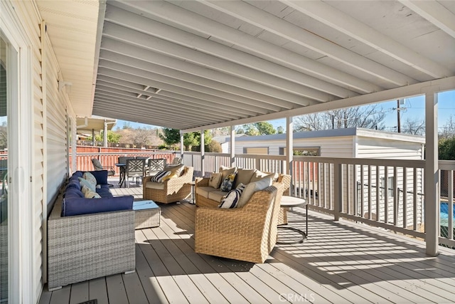 wooden terrace featuring an outdoor living space