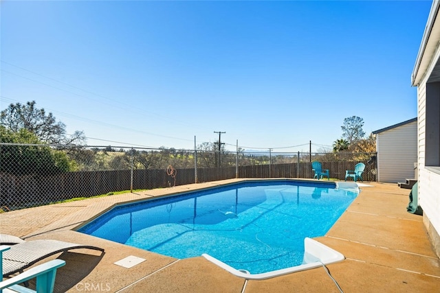 view of pool with a fenced in pool, a fenced backyard, and a patio area