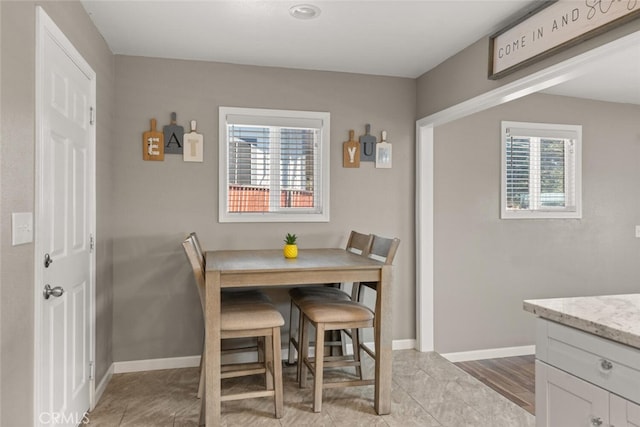 dining room with baseboards