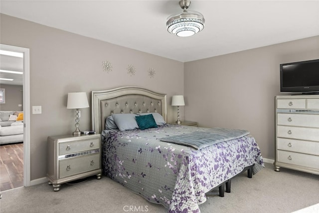 bedroom with baseboards and carpet floors