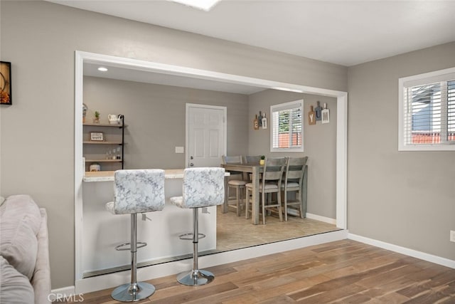 dining area with hardwood / wood-style flooring