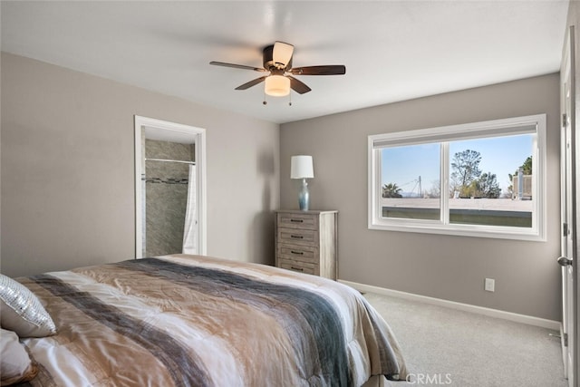 carpeted bedroom with a ceiling fan and baseboards