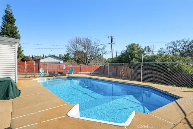 view of swimming pool featuring a fenced in pool, a patio, and a fenced backyard