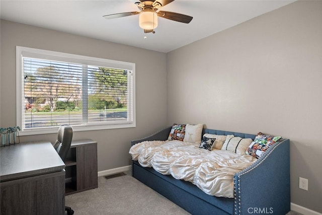 bedroom with ceiling fan and light colored carpet