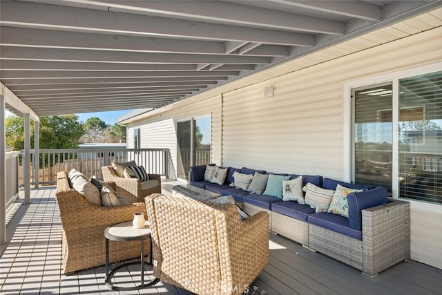 wooden deck featuring an outdoor hangout area