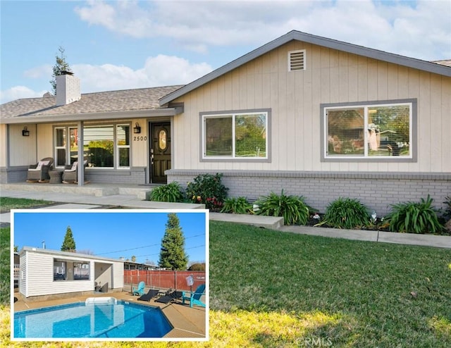 rear view of property featuring fence, a fenced in pool, a shingled roof, a chimney, and a lawn