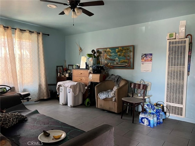 tiled living room featuring ceiling fan