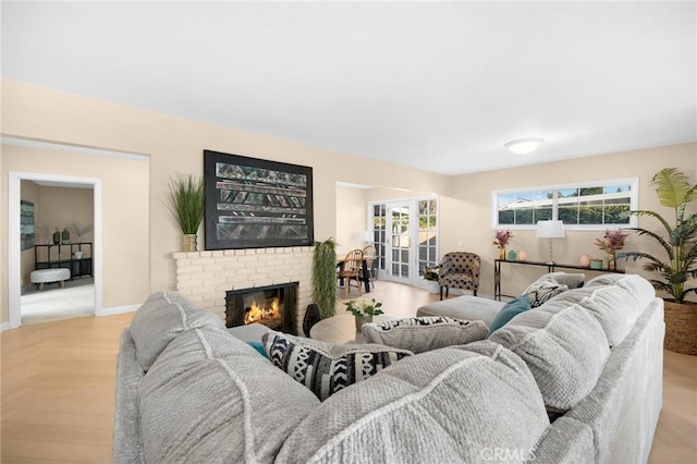 living room with a healthy amount of sunlight and a fireplace