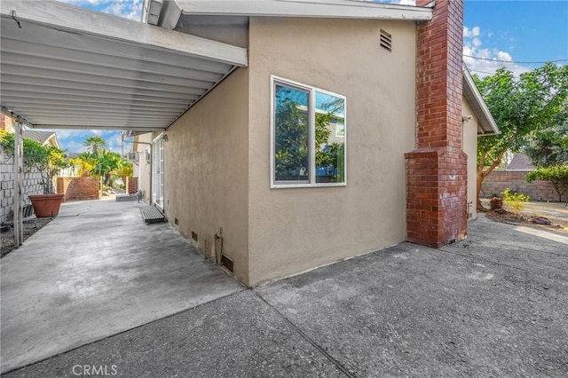 view of home's exterior with a patio area