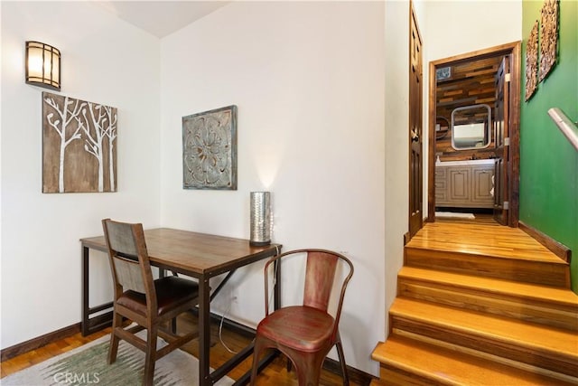 dining space with hardwood / wood-style flooring