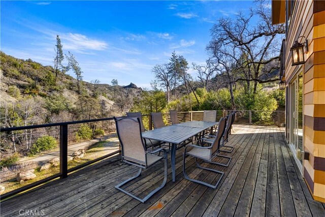 wooden deck with a mountain view