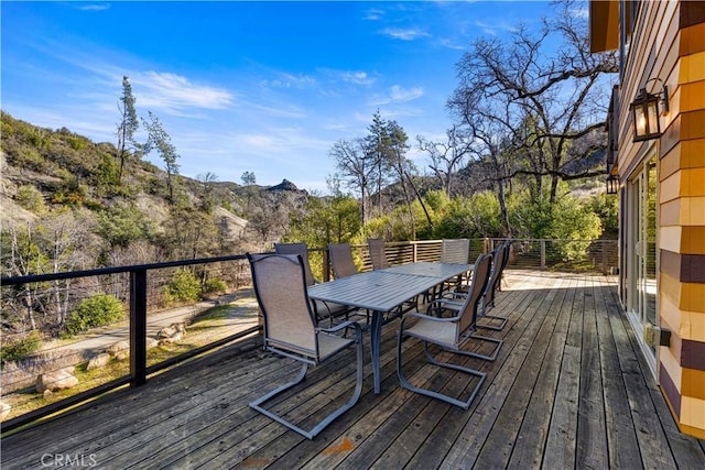 wooden terrace with a mountain view