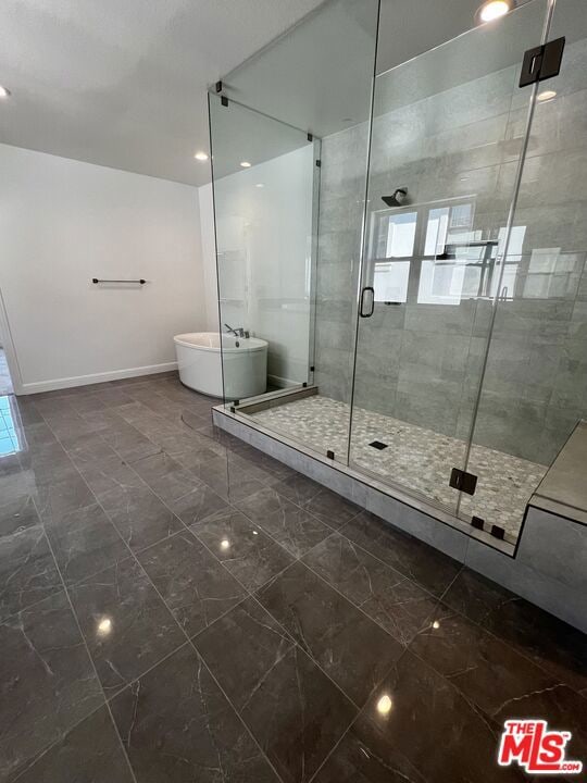 bathroom featuring plus walk in shower