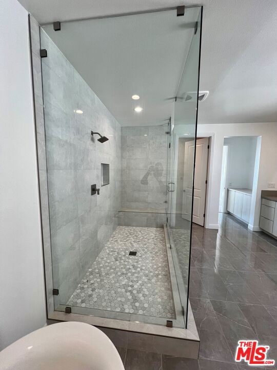 bathroom with vanity and an enclosed shower