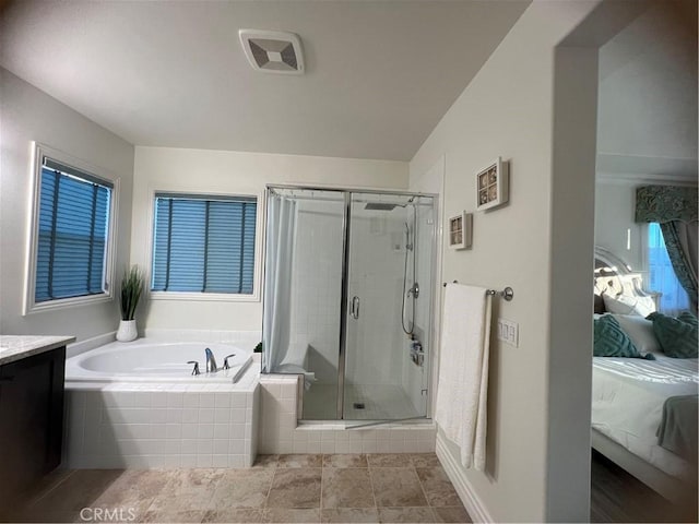 bathroom with independent shower and bath and vanity