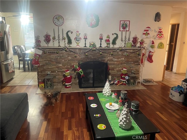 living room featuring a fireplace and hardwood / wood-style flooring