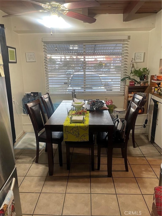 tiled dining room featuring ceiling fan