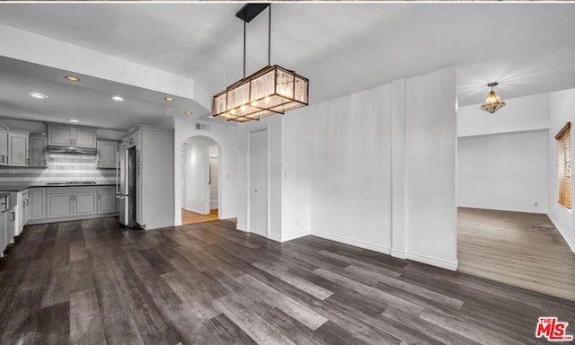 unfurnished living room with dark wood-type flooring