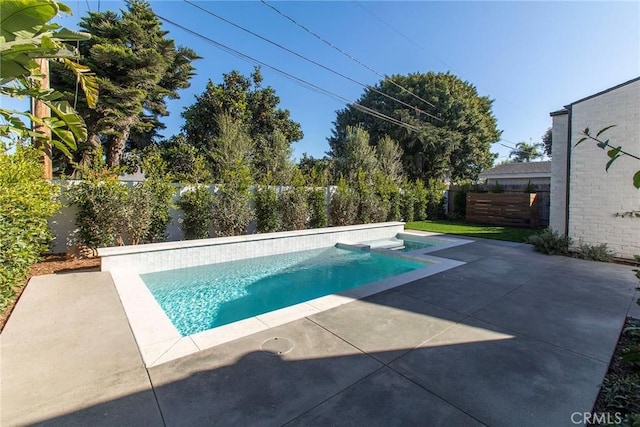 view of swimming pool featuring a patio area