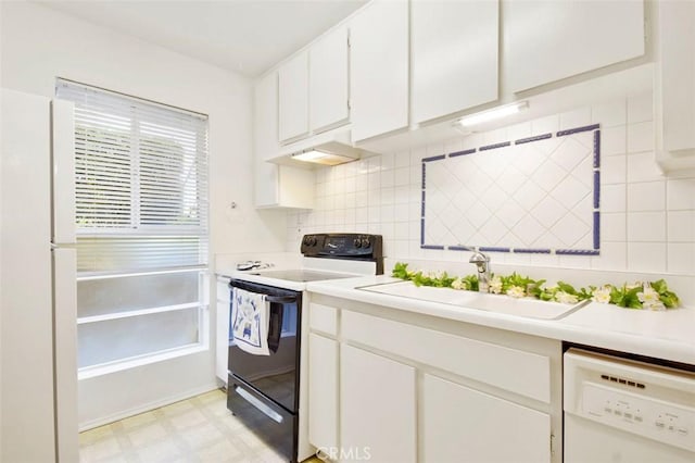 kitchen featuring white cabinets, backsplash, white appliances, and sink