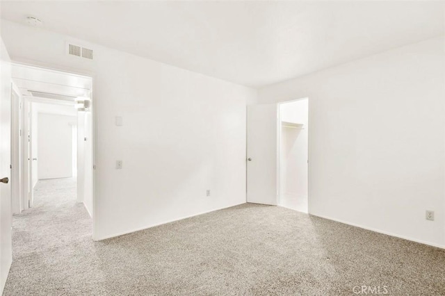 spare room with light colored carpet