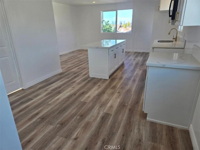 kitchen featuring sink, white cabinets, and dark hardwood / wood-style flooring