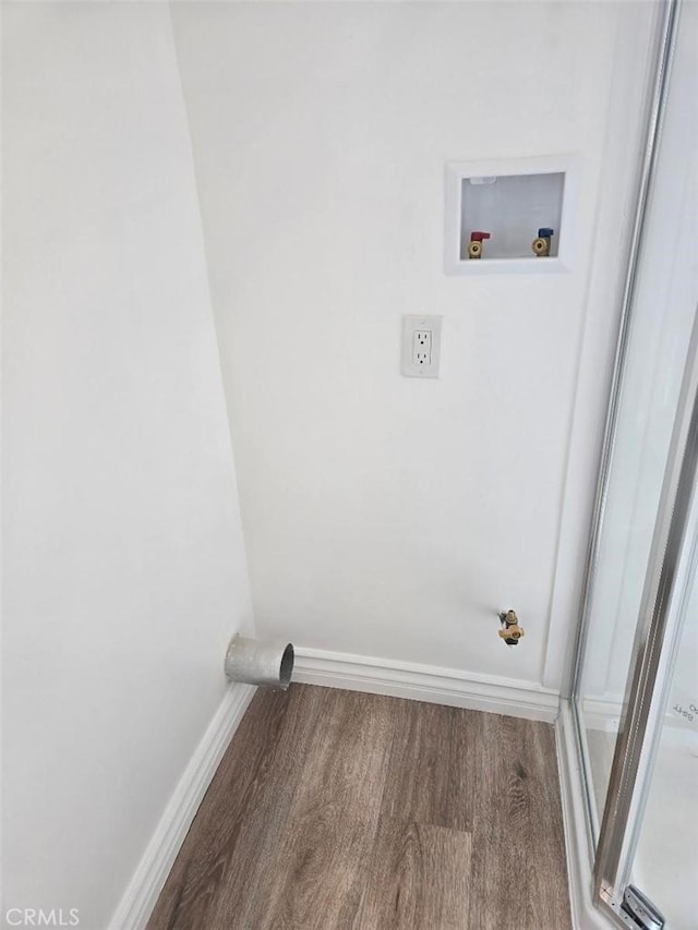 laundry area featuring hookup for a washing machine and hardwood / wood-style floors