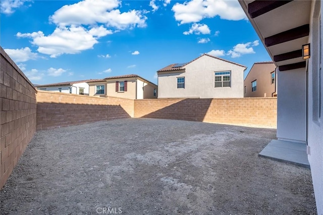 view of yard featuring a fenced backyard and a patio