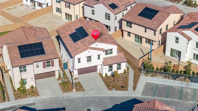 birds eye view of property with a residential view