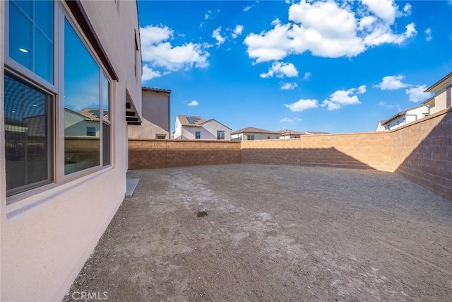 view of yard featuring a patio area and a fenced backyard