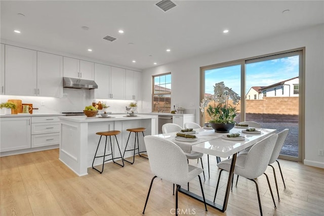 dining area featuring recessed lighting, visible vents, and light wood-style floors