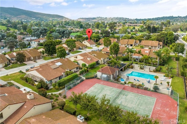 birds eye view of property featuring a mountain view