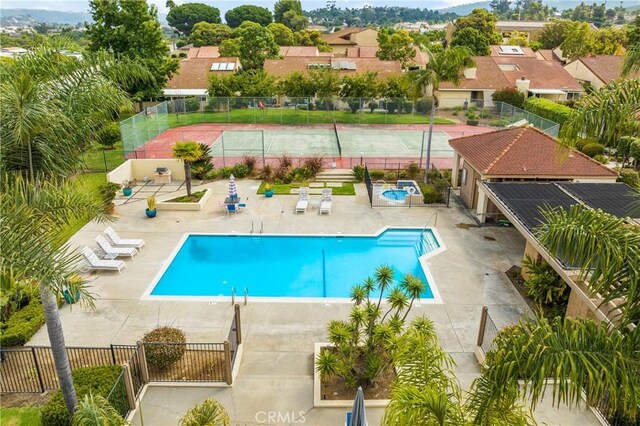 view of swimming pool with a patio area