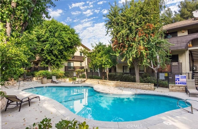 view of pool featuring a patio