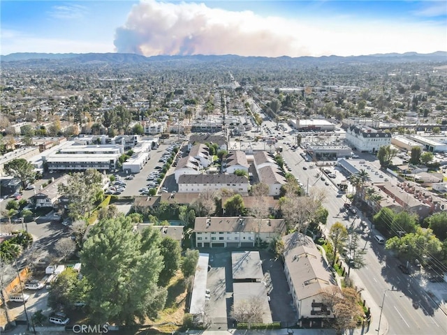 birds eye view of property with a mountain view