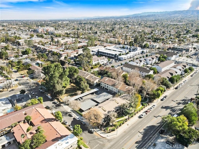 birds eye view of property featuring a mountain view