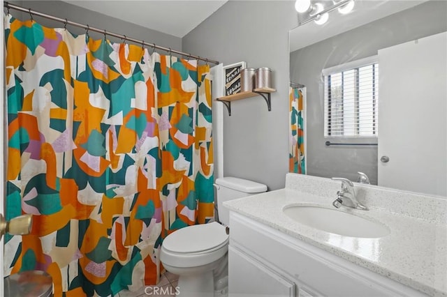 bathroom with tile patterned floors, vanity, toilet, and a shower with curtain