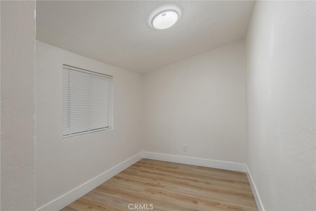 unfurnished room featuring light hardwood / wood-style floors