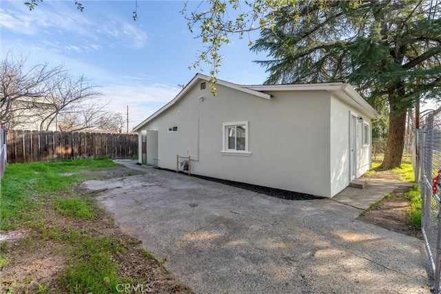 view of side of property featuring a patio