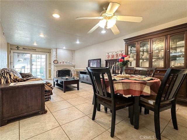 dining room with light tile patterned floors and ceiling fan