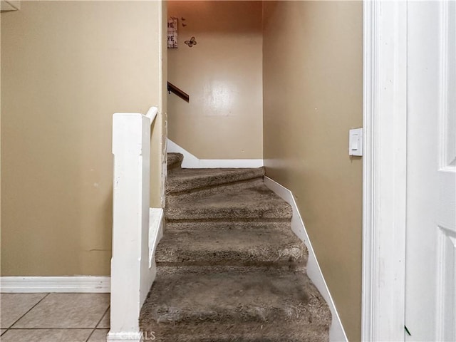 staircase with tile patterned floors