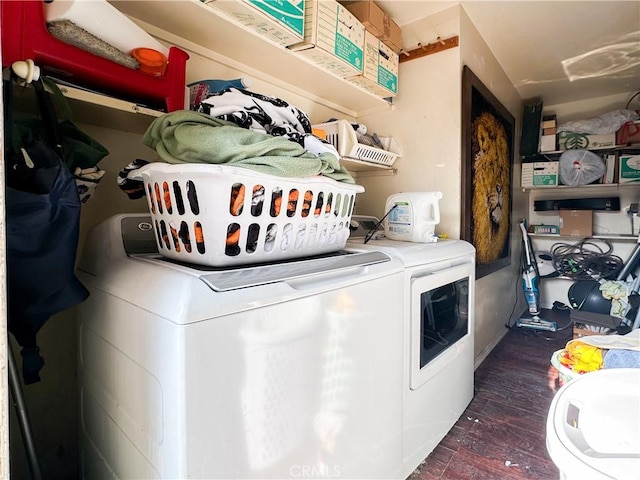 washroom with washing machine and clothes dryer