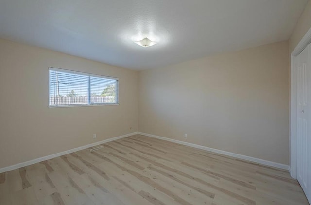 unfurnished room featuring light hardwood / wood-style floors